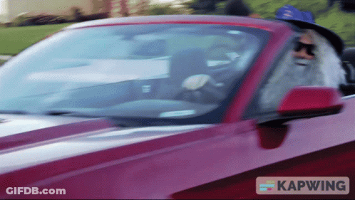 Man With Beard Driving Red Kapwing Car GIF