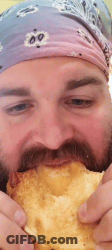 Man With Beard Eating Bread GIF