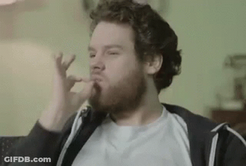 Man With Beard Eating Food On Couch GIF