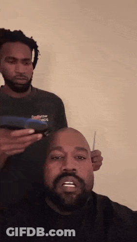 Man With Beard Getting Head Shaved By Dreadlocked Barber GIF