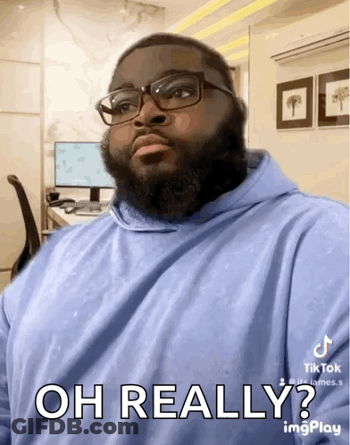 Man With Beard Glasses And Blue Hoodie Says Oh Really GIF