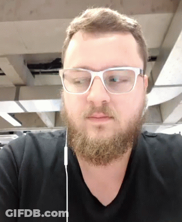 Man With Beard Glasses And Ear Buds GIF