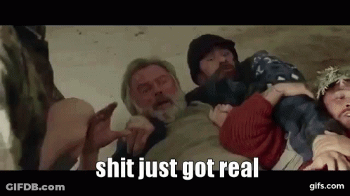 Man With Beard Held By Group Of People GIF