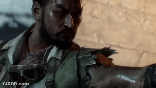 Man With Beard Holding Broken Arm GIF