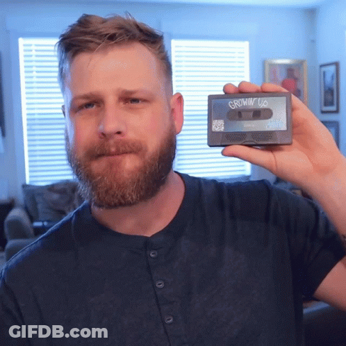 Man With Beard Holding Cassette Tape Saying Growin' Up GIF