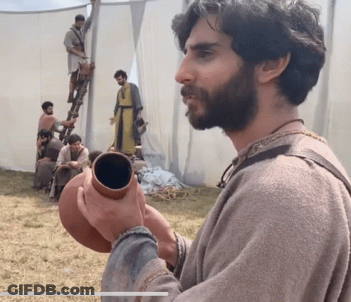 Man With Beard Holding Clay Pot GIF