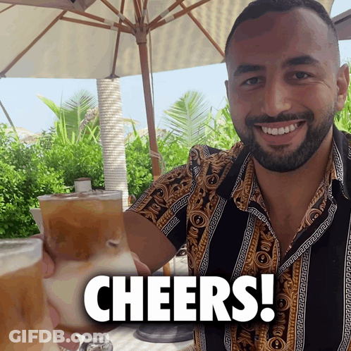 Man With Beard Holding Drink Cheers Sign GIF