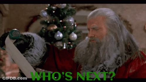 Man With Beard Holding Green Paper Saying Who's Next GIF