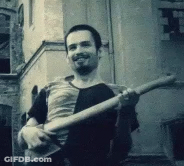 Man With Beard Holding Guitar GIF