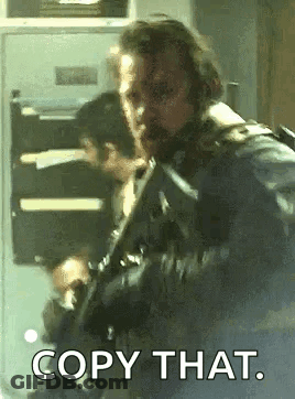 Man With Beard Holding Gun Saying Copy That GIF