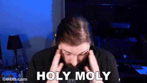Man With Beard Holding Head Saying Holy Moly GIF