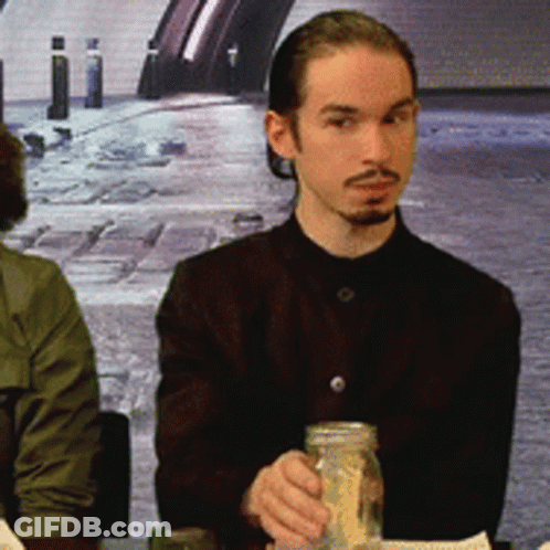Man With Beard Holding Jar Of Rice GIF