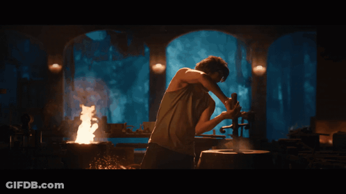 Man With Beard Holding Large Knife GIF