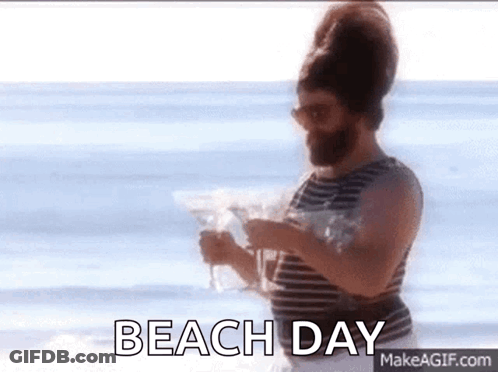 Man With Beard Holding Martini On Beach GIF