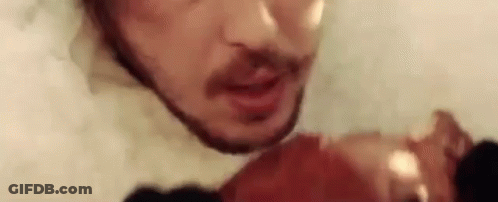 Man With Beard Holding Meat GIF