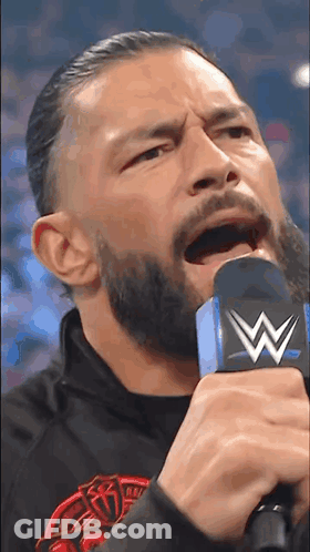 Man With Beard Holding Microphone GIF