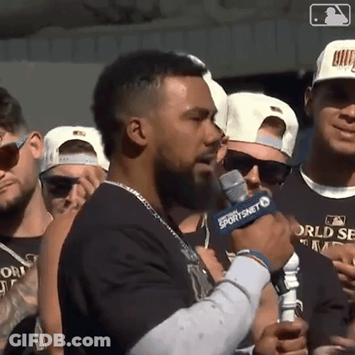 Man With Beard Holding Microphone GIF