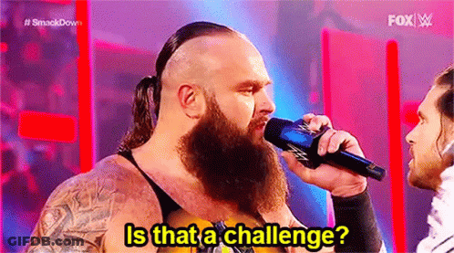Man With Beard Holding Microphone Talking On Stage GIF