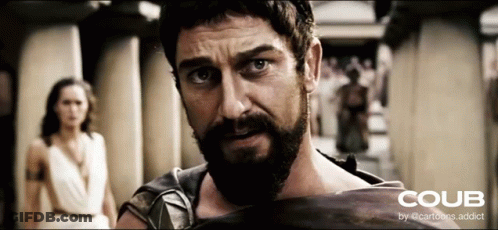 Man With Beard Holding Shield In Front Of Woman GIF