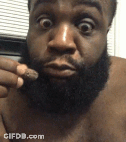 Man With Beard Holding Something GIF