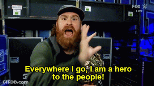 Man With Beard Holding Trophy Everywhere I Go I Am A Hero To The People GIF