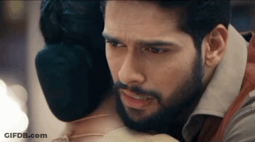 Man With Beard Hugging Woman With Bloody Face GIF