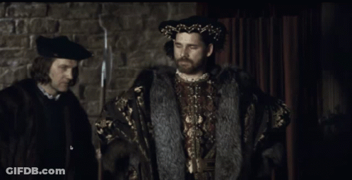 Man With Beard In Black Hat And Fur Coat GIF