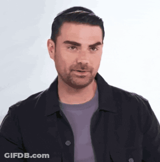 Man With Beard In Black Jacket And Purple Shirt GIF