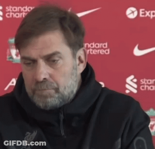 Man With Beard In Black Jacket Says Standard Chartered GIF