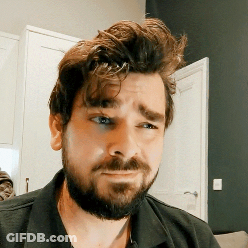 Man With Beard In Black Shirt Making Funny Face GIF