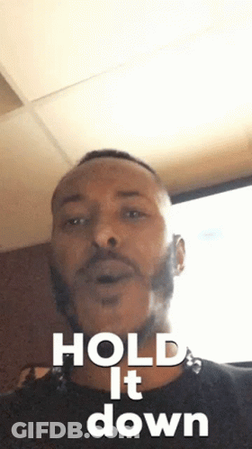 Man With Beard In Black Shirt Says Hold It Down GIF
