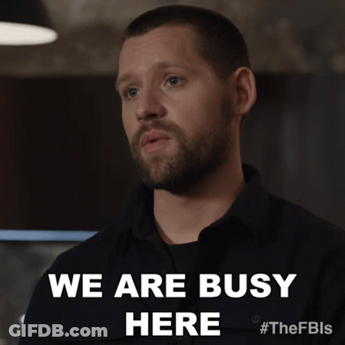 Man With Beard In Black Shirt Says We Are Busy Here GIF