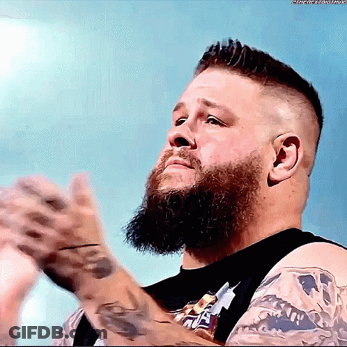 Man With Beard In Black Snickers Shirt GIF