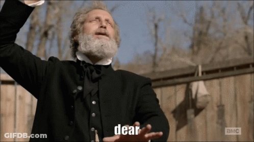 Man With Beard In Black Suit Says Dear GIF