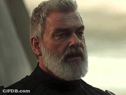 Man With Beard In Black Turtleneck Looking At Camera GIF