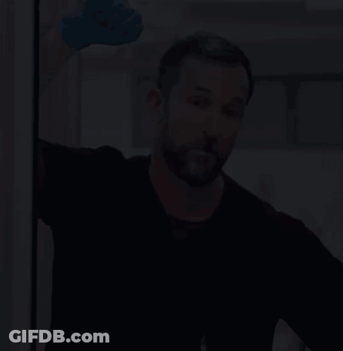 Man With Beard In Blue Glove And Black Shirt GIF