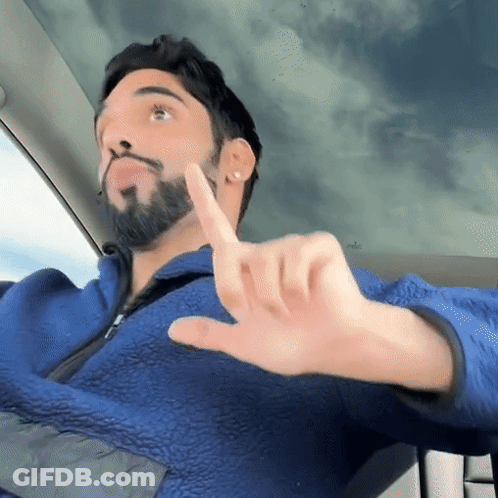 Man With Beard In Blue Jacket Thumbs Down GIF