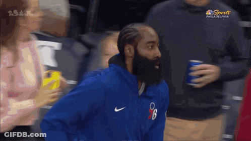 Man With Beard In Blue Nike Jacket In Crowd GIF