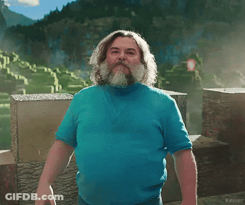 Man With Beard In Blue Shirt And L On Sleeve GIF