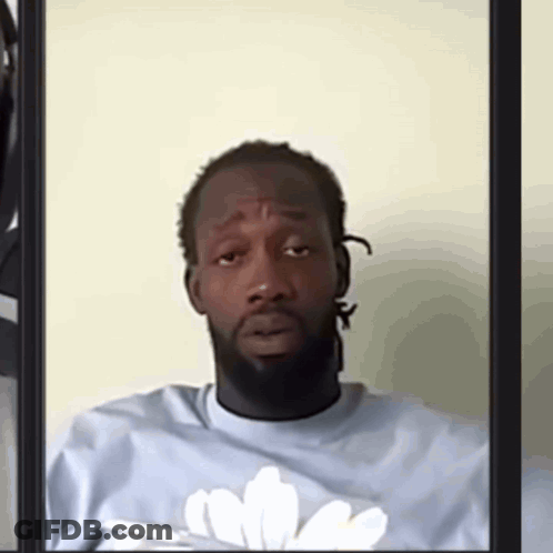 Man With Beard In Blue Shirt And White Flower GIF