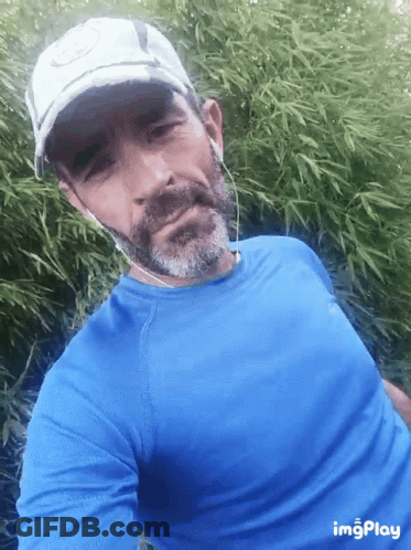 Man With Beard In Blue Shirt And White Hat GIF