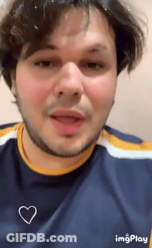 Man With Beard In Blue Shirt And White Heart GIF