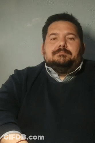 Man With Beard In Blue Sweater And Blue Shirt GIF