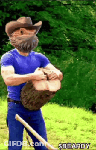 Man With Beard In Cowboy Hat Holding Large Log GIF