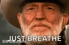 Man With Beard In Cowboy Hat Saying Just Breathe GIF