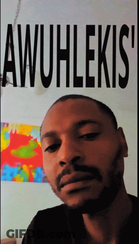 Man With Beard In Front Of Awuhlekis Poster GIF