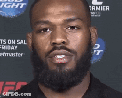 Man With Beard In Front Of Bud Light Sign GIF