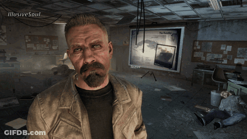 Man With Beard In Front Of Bulletin Board With Picture Of Man GIF
