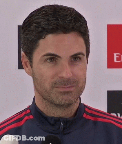 Man With Beard In Front Of Emirates Banner GIF
