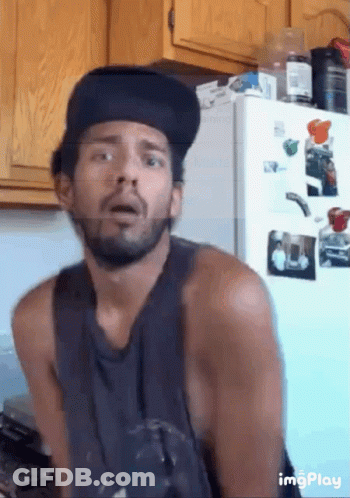 Man With Beard In Front Of Fridge Saying Moving GIF